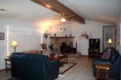 Room for the family to gather in frony of the wood burning fireplace